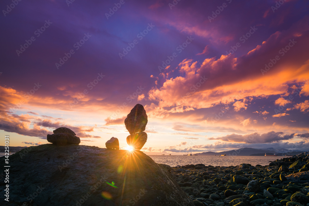 Fototapeta premium Rock balance with sunset sky backgrounds