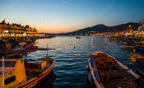 Foca, Turkey - September 29, 2013: Fishing boats at dawn in Foca town near Izmir, Turkey photo
