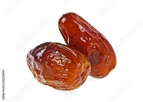 Two dates fruit isolated on a white background