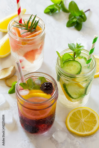 Refreshing summer drinks with blackberries, grapefruit, lemon and mint, water sassi. The concept of healthy and dietary nutrition.