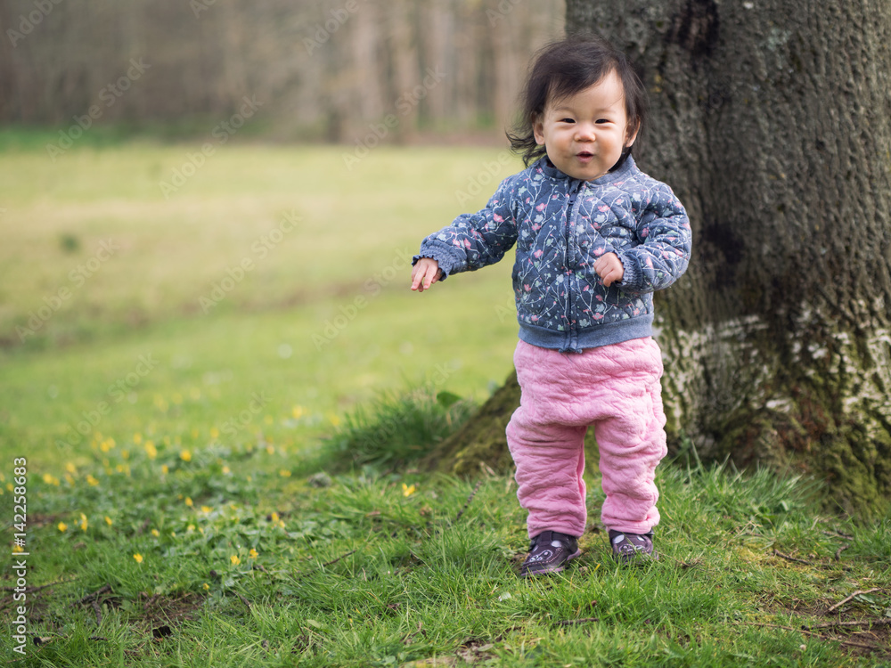 baby girl walking outdoor first time baby girl walking outdoor first time