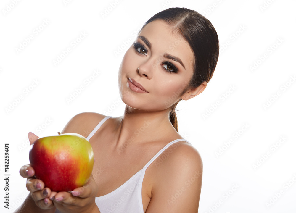 Beautiful close-up portrait of young woman with red apple. Healthy food concept. Skin care and beauty. Vitamins and minerals. Beautiful close-up portrait of young woman with red apple. Healthy food concept. Skin care and beauty. Vitamins and minerals.