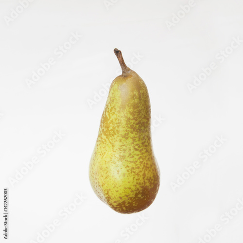 green pear on a white background