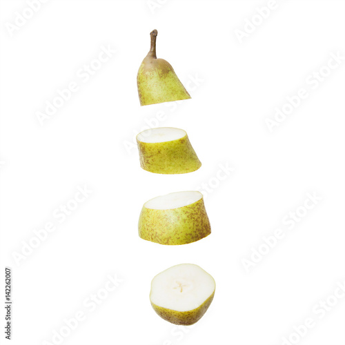 cut pear is flying in the air on white background