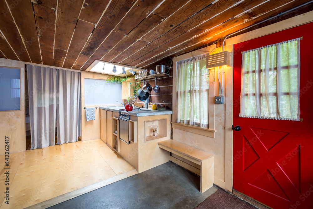 Rustic kitchen in a bright cabin. Interior design. Rustic kitchen in a bright cabin. Interior design.