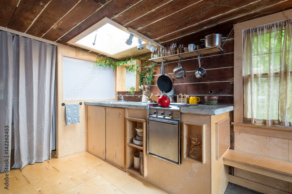 Obraz premium Rustic kitchen in a bright cabin. Interior design.