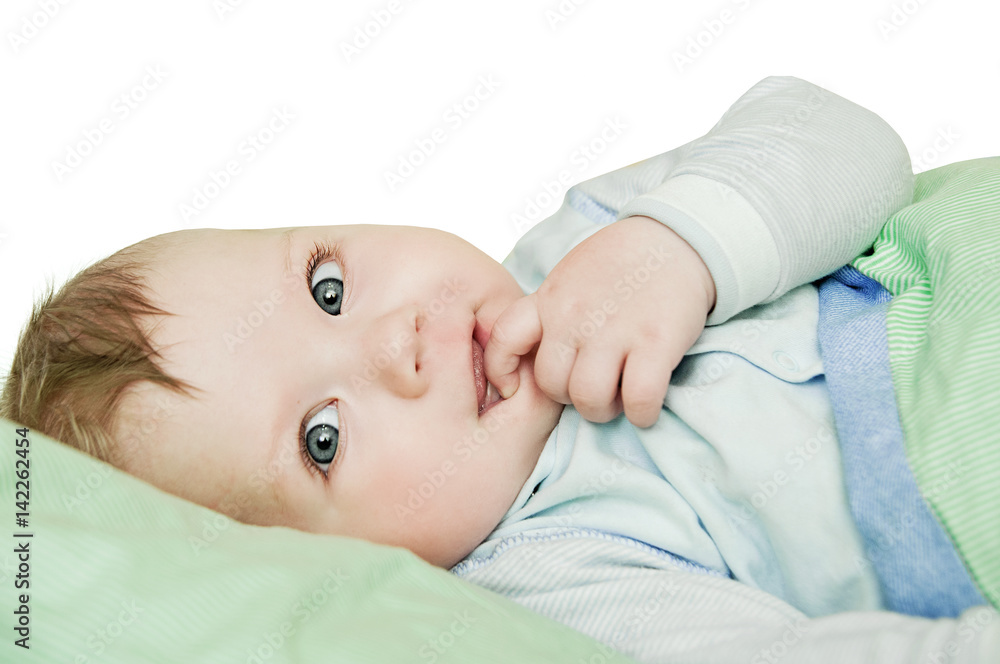 Newborn child relaxing in bed after bath or shower. Nursery for
