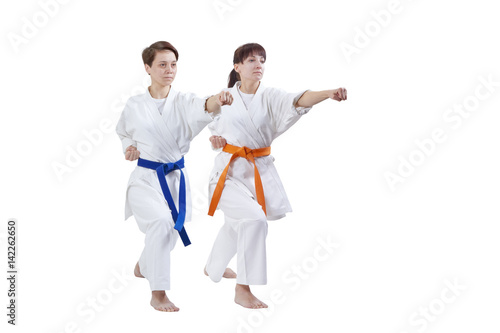 Girls in karategi are training punch hand