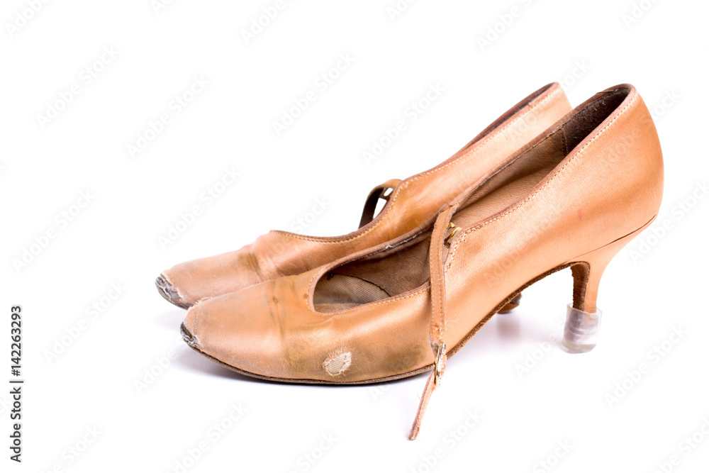 closeup shot of pair of worn-out latin ballroom dance shoe - isolated closeup shot of pair of worn-out latin ballroom dance shoe - isolated