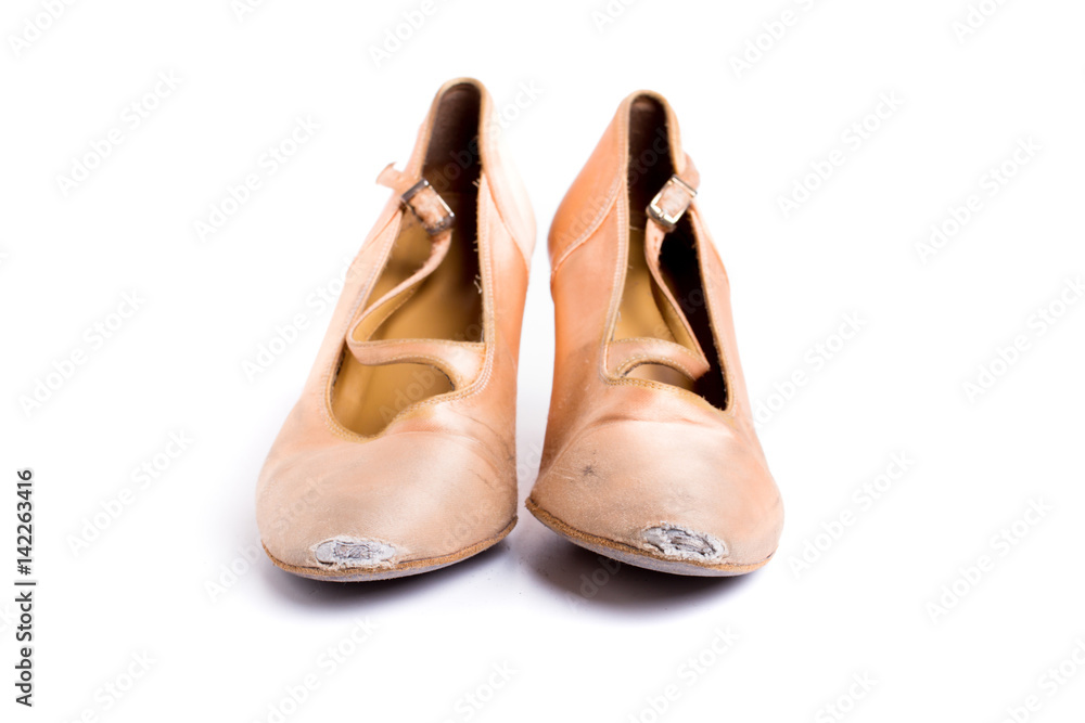 closeup shot of pair of worn-out latin ballroom dance shoe - isolated closeup shot of pair of worn-out latin ballroom dance shoe - isolated