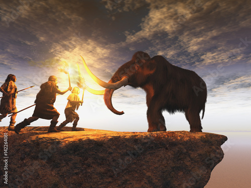 Hombres prehistóricos cazando un joven mamut photo