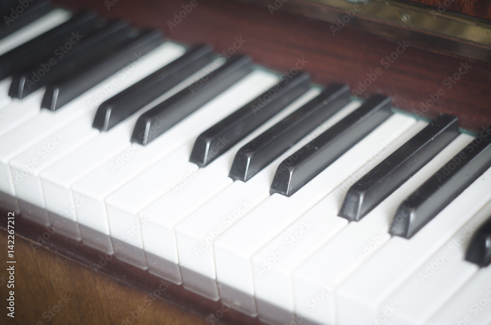 Piano keyboard background with selective focus. Warm color toned image Piano keyboard background with selective focus. Warm color toned image
