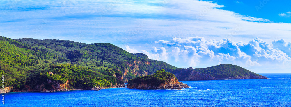 Naklejka premium Beautiful summer panoramic seascape. View of the coastline into the sea bays with crystal clear azure water. Paleokastrica. Corfu. Greece.