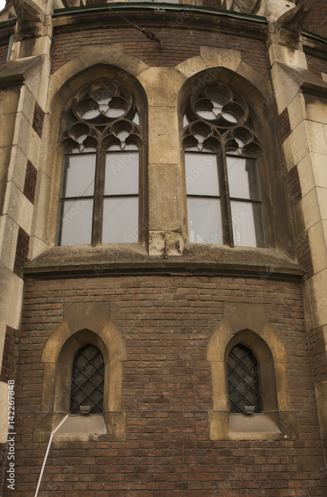 Medieval window on the facade of the Church of St. Olga and Elizabeth