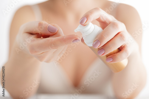 Woman Hands With Natural Manicure Nails Applying Cosmetic Hand Cream On Soft Silky Healthy Skin
