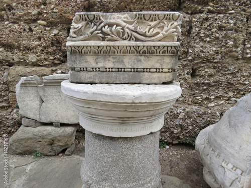 Part of the ancient columns and friezes on the ruins of the ancient city of Side photo