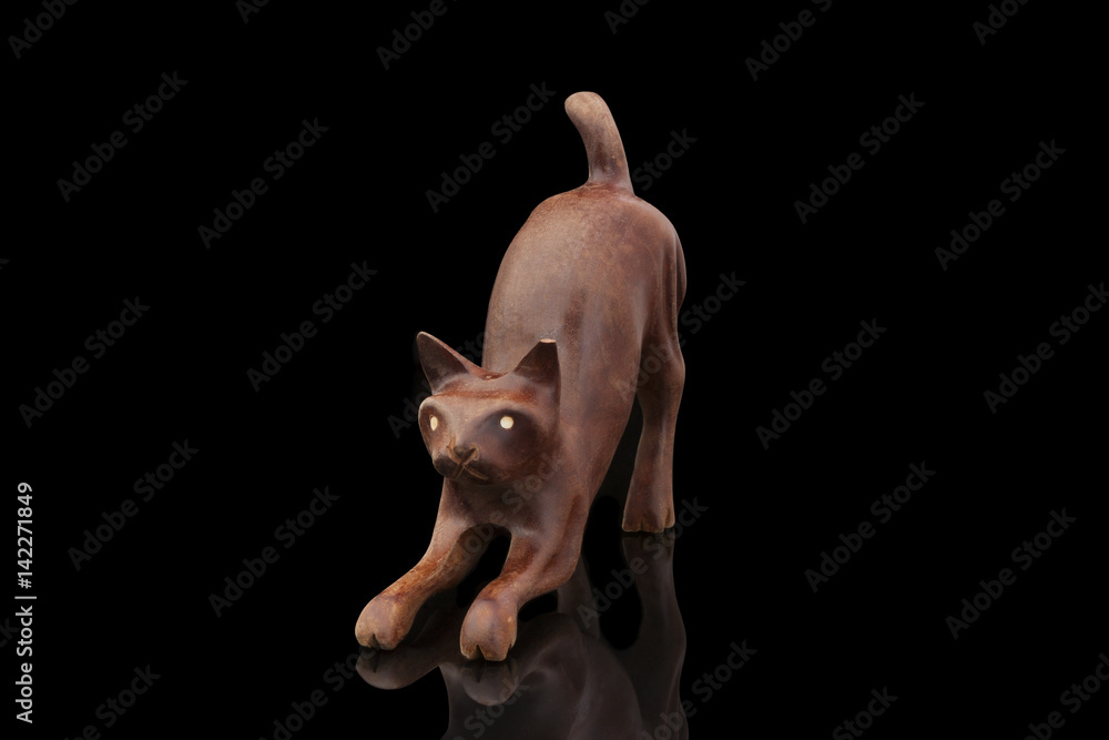 Statuette of a cat from a brown sandalwood