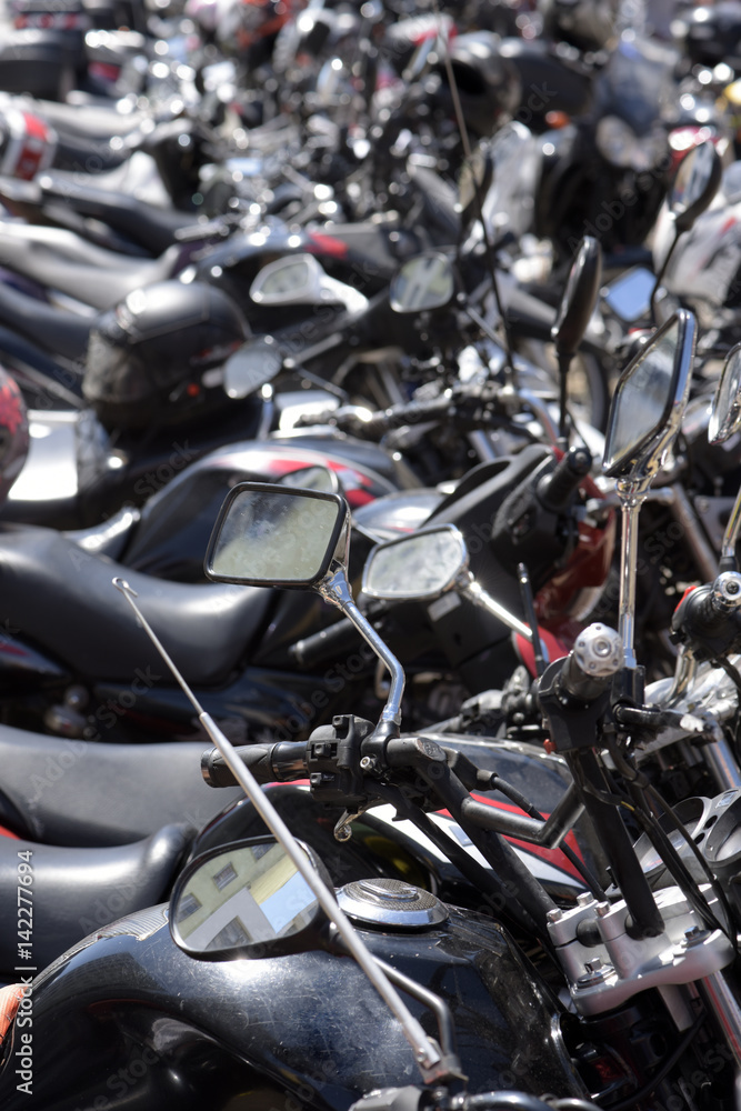 Visual chaos of motorcycle parking on the street Visual chaos of motorcycle parking on the street