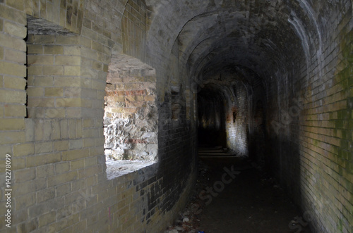 Dark passage inside a ruined castle