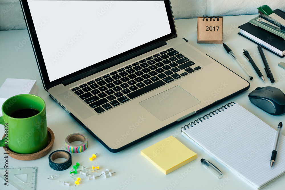 Workspace with laptop notebook stick notes scotch coffee cup on white background. Template mock up place for text Office table desk. Freelancer working place area. Working at home or online concept Workspace with laptop notebook stick notes scotch coffee cup on white background. Template mock up place for text Office table desk. Freelancer working place area. Working at home or online concept