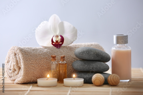 Spa composition with flower on color background