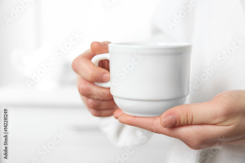 Closeup view of woman holding cup