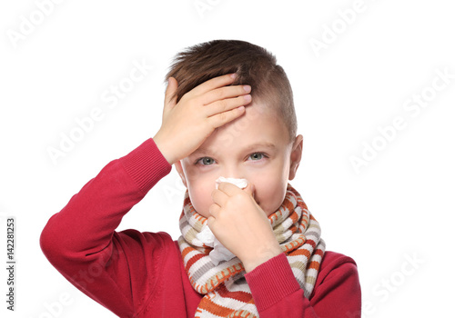Cute little boy blowing his...