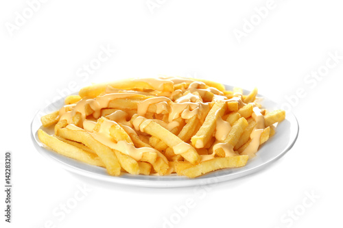 Plate of delicious french fries with cheese sauce on white background