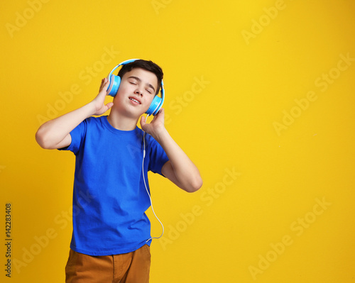Teenager with headphones li...