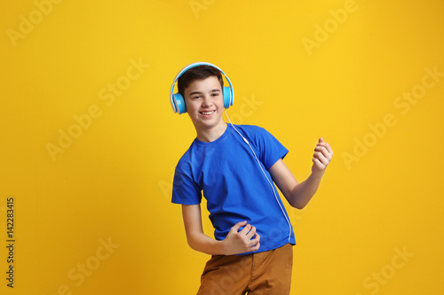 Teenager with headphones li...