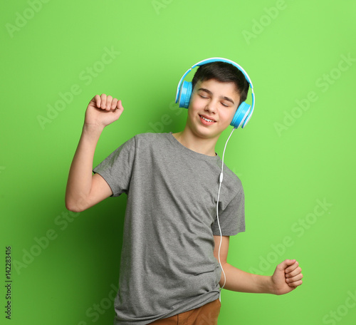 Teenager with headphones li...