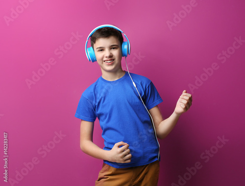 Teenager with headphones li...