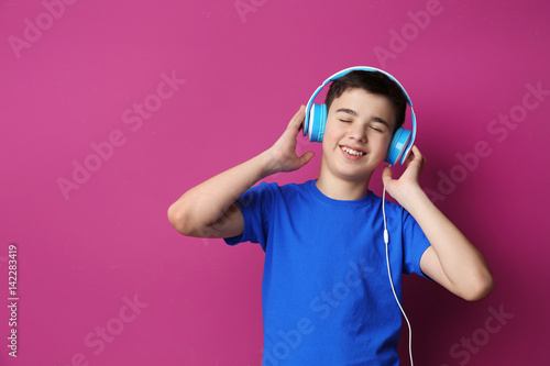 Teenager with headphones li...