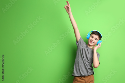 Teenager with headphones li...