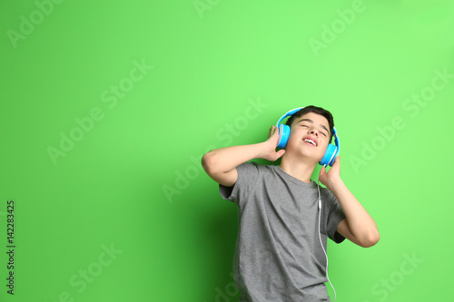 Teenager with headphones li...
