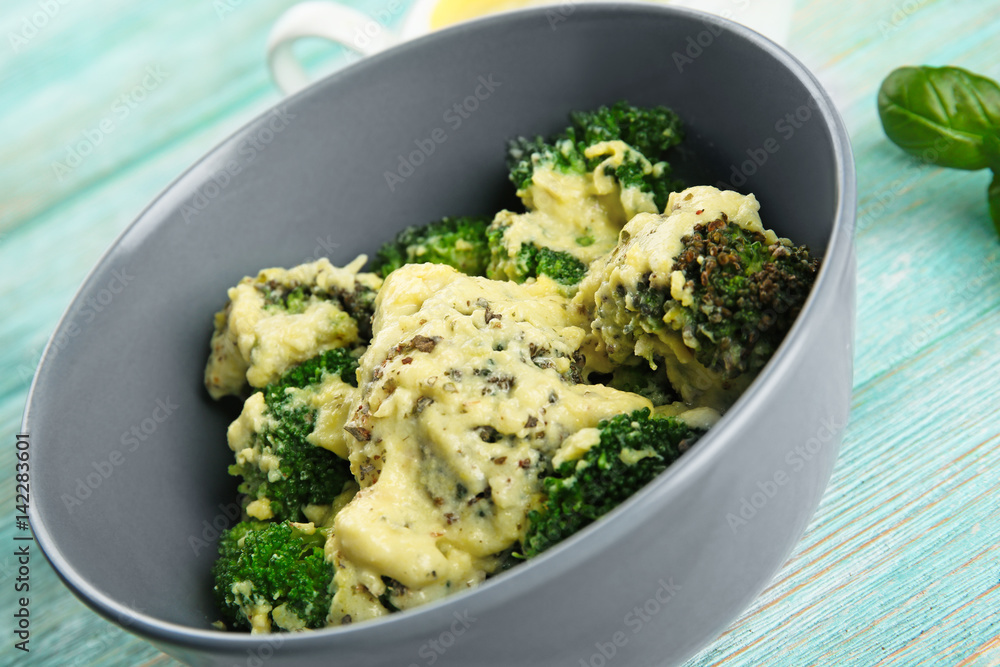 Grey bowl of delicious broccoli with cheese cream, closeup Grey bowl of delicious broccoli with cheese cream, closeup