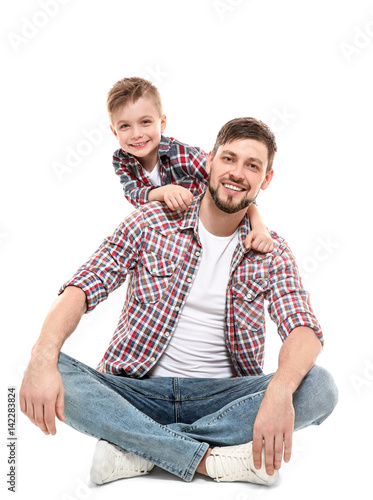 Handsome man with his son o...