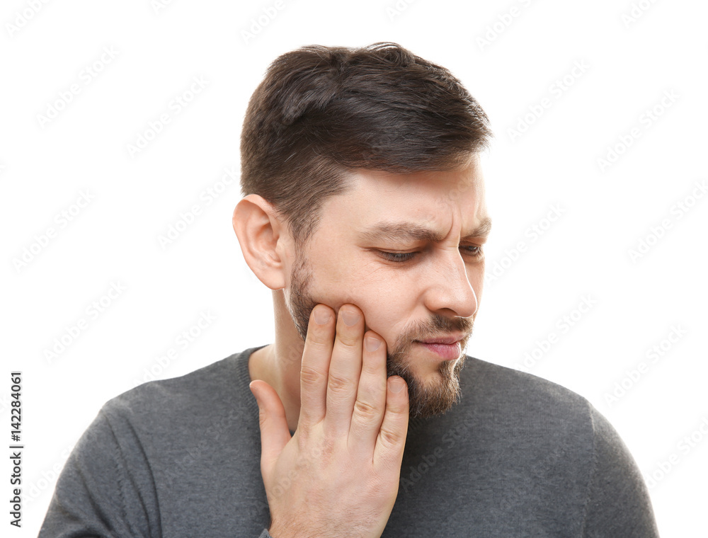 Handsome man suffering from toothache on white background Handsome man suffering from toothache on white background