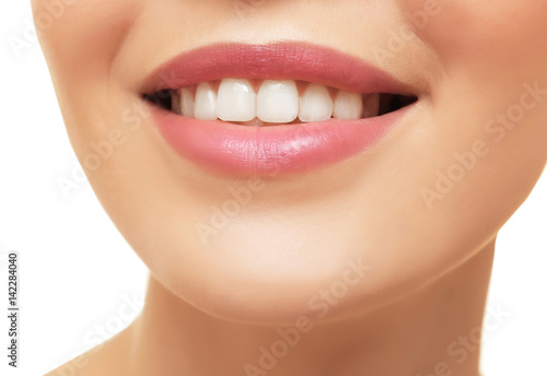 Smiling young woman on white background  closeup