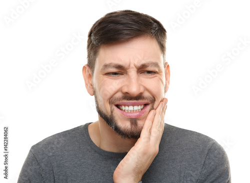Handsome man suffering from...