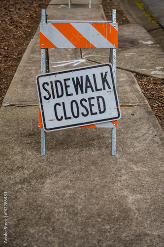 Sidewalk Closed Sign Askew with Copy Space Below