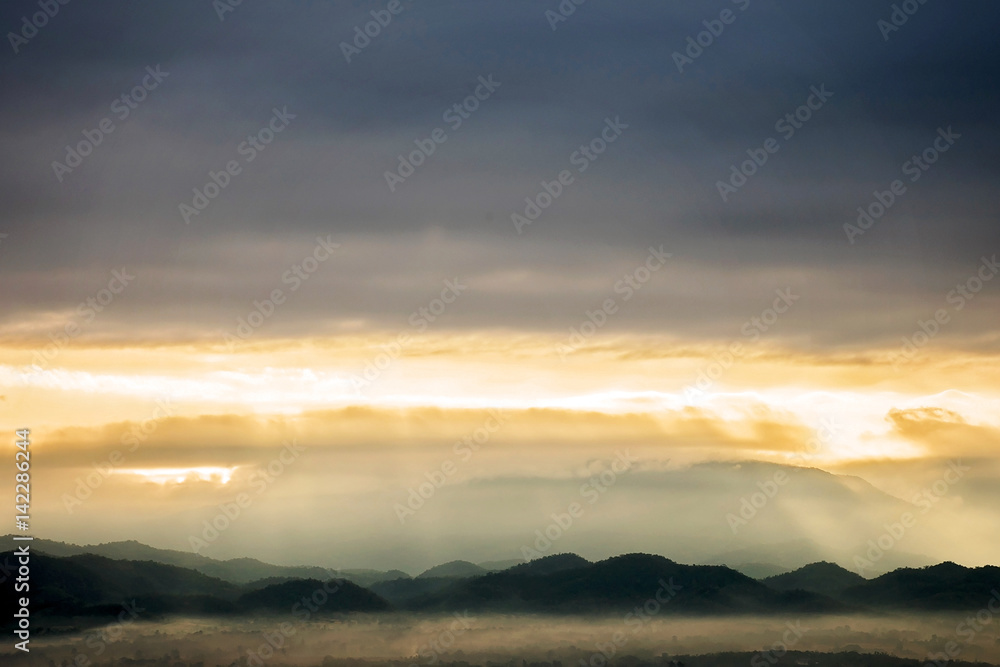 mountains landscape under morning sky with clouds.