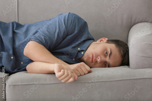 Handsome depressed man on c...