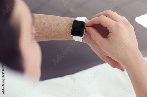 Young man with sleep tracke...