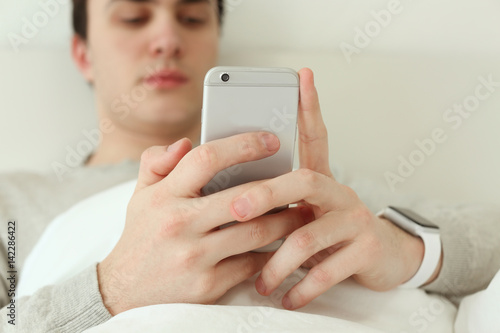 Young man with sleep tracke...