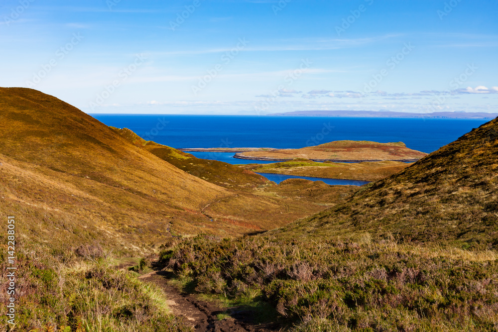 Looking down on Staffin Bay and Staffin Island from the pathway leading to the Quiraing at Flodigarry, Trotternish, Isle of Skye, Scotland, UK.