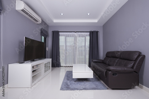 residential interior of modern living room with sofa and TV © geargodz