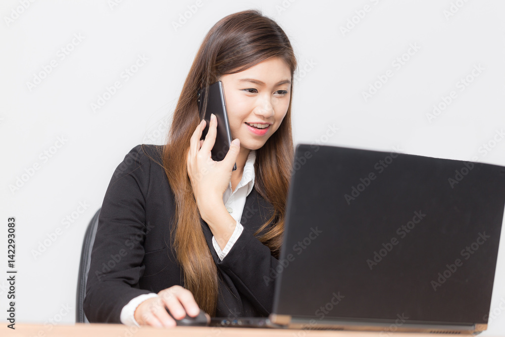 Beautiful Asian business women talking with partner and looking sale report feeling so happiness Beautiful Asian business women talking with partner and looking sale report feeling so happiness
