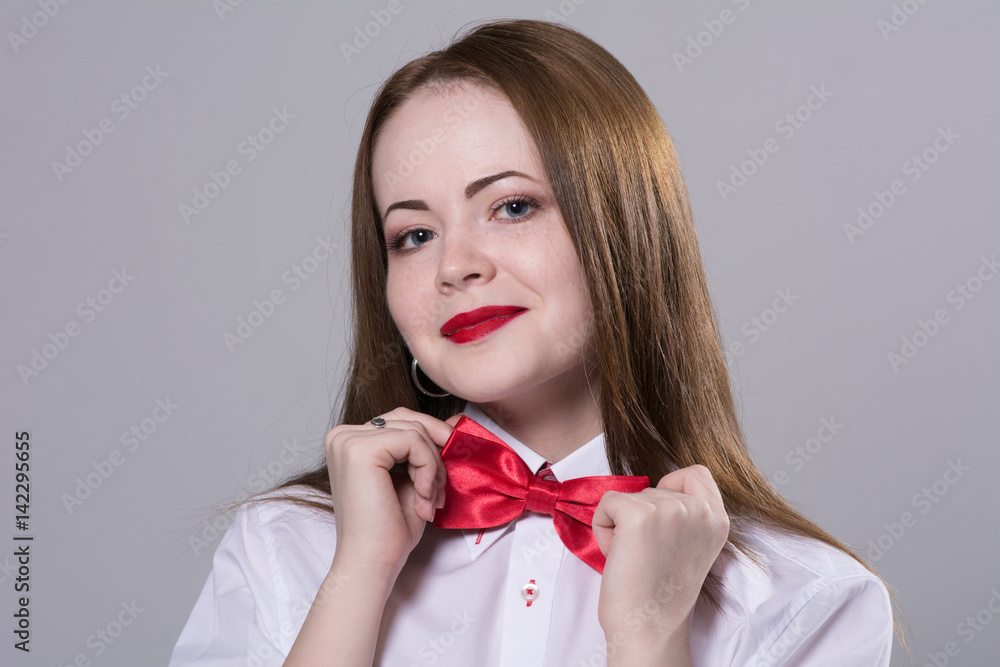 Close-up portrait of a young woman with a butterfly around her neck. Close-up portrait of a young woman with a butterfly around her neck.