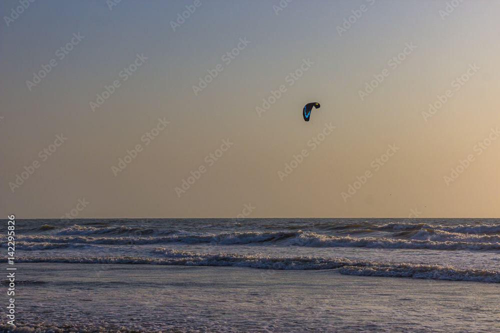 Kitesurf at sea on a sunset, Arambol beach, Goa, India Kitesurf at sea on a sunset, Arambol beach, Goa, India